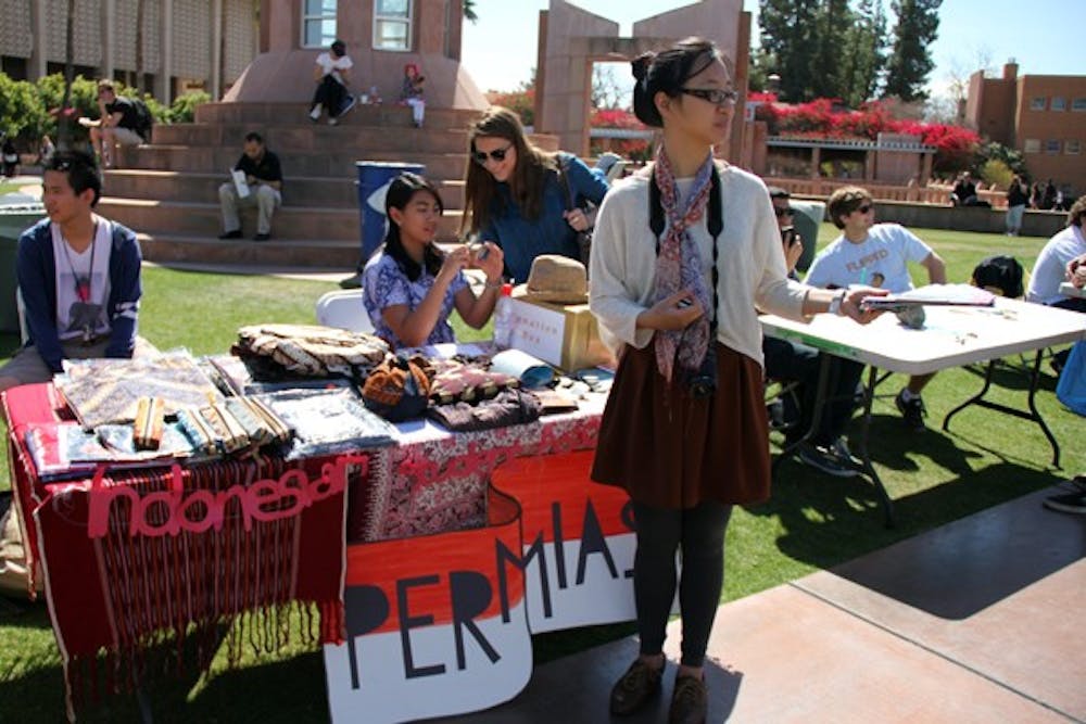 Student and Cultural Engagement sponsored World Fest on Hayden Lawn at the Tempe campus Tuesday, featuring international organizations across campus and the diverse foods, crafts and artifacts of their countries.  (Photo by Diana Lustig)