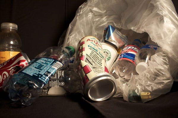 KNOW HOW TO RECYCLE: Recycling bins can pretty much be seen everywhere on campus. However, contamination with liquids and other non-recycable items can cause the entire contents of the recycling bin to be discarded, eliminating the benefits of recycling. (Photo by Scott Stuk)