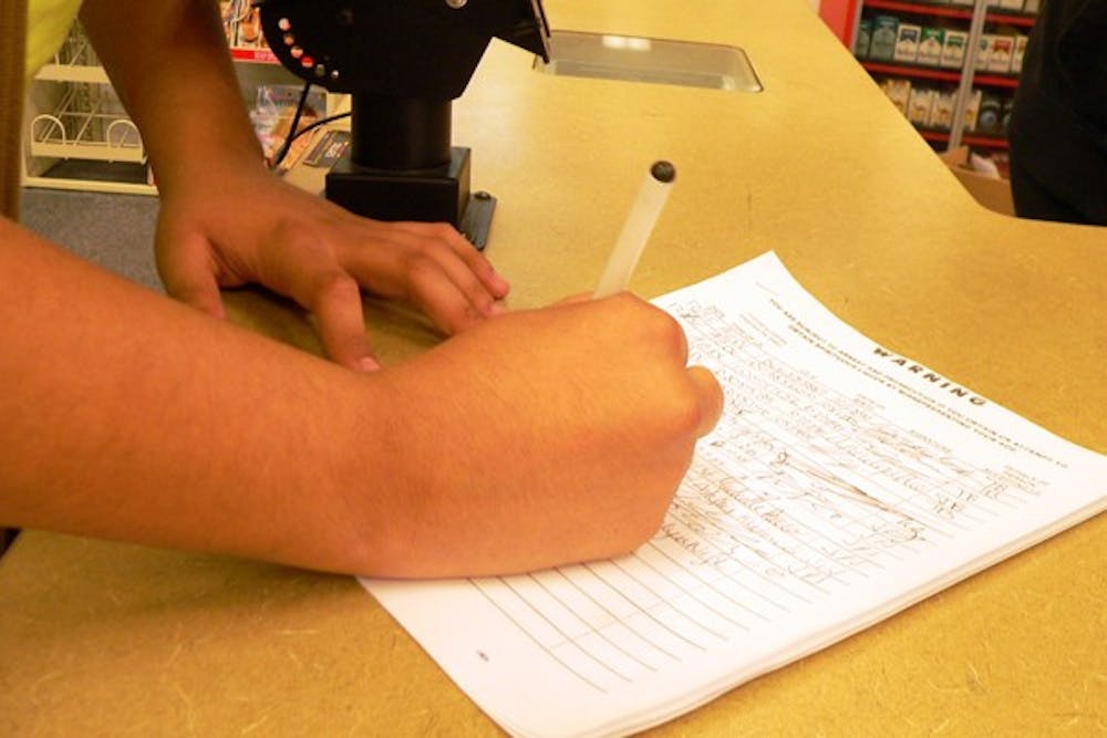 Two CVS stores in Tempe are now requiring alcohol buyers to sign a release stating that they are of age and releasing them from any liability associated with the alcohol purchased at the store. (Photo by Adrian Juarez)