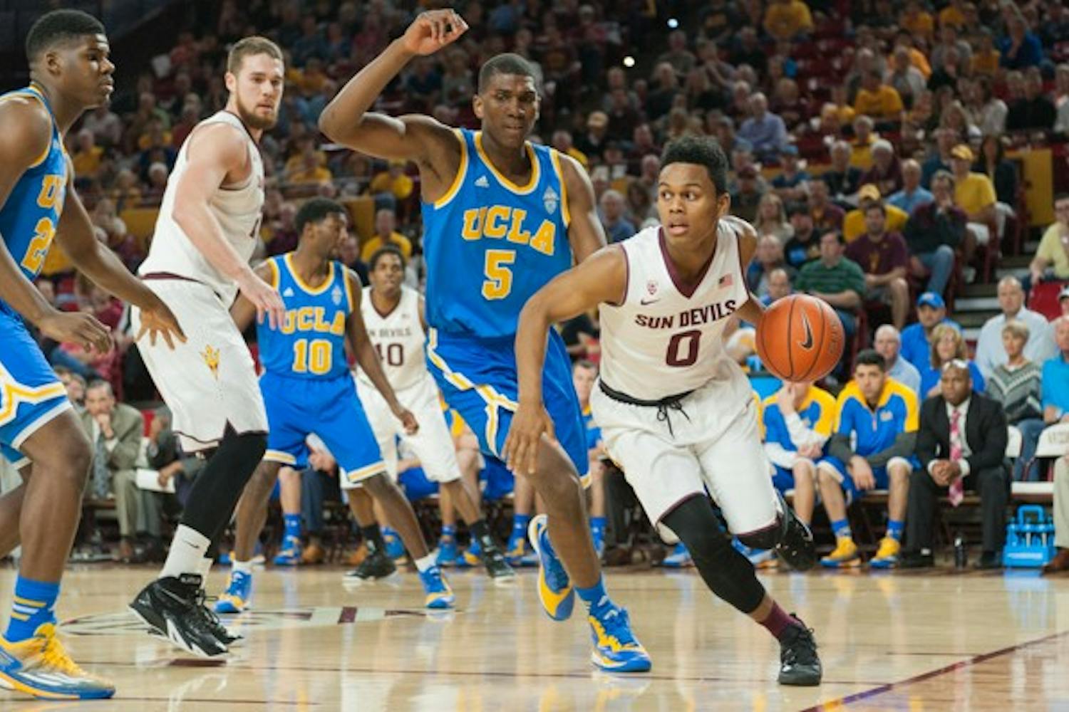 Freshman guard Tra Holder dribbles the ball in a game against UCLA on Wednesday, Feb. 18, 2015, at Wells Fargo Arena in Tempe. The Sun Devils defeated the Bruins 68-66. (Ben Moffat/The State Press)