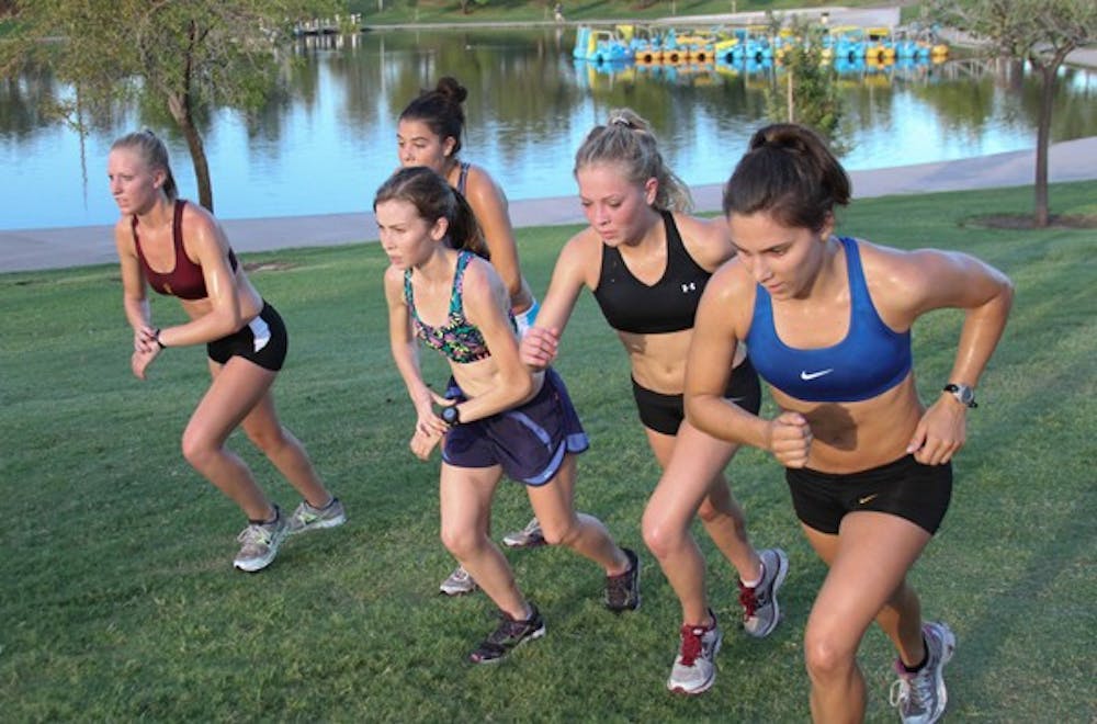 Several runners from the ASU women’s cross-country team control their pace during a practice last season. (Photo by Lisa Bartoli)
