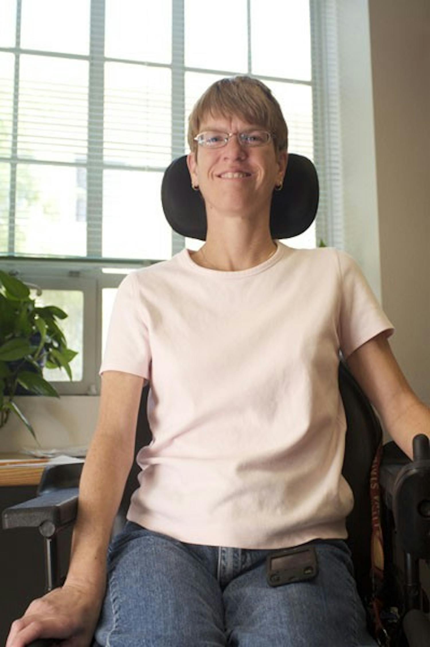 A HELPING HAND: Renae Hackman is the supervisor of testing accommodations at the ASU Disability Resource Center. Living with cerebral palsy, Hackman is an inspiration to the hundreds of students she helps each year. (Photo by Scott Stuk)
