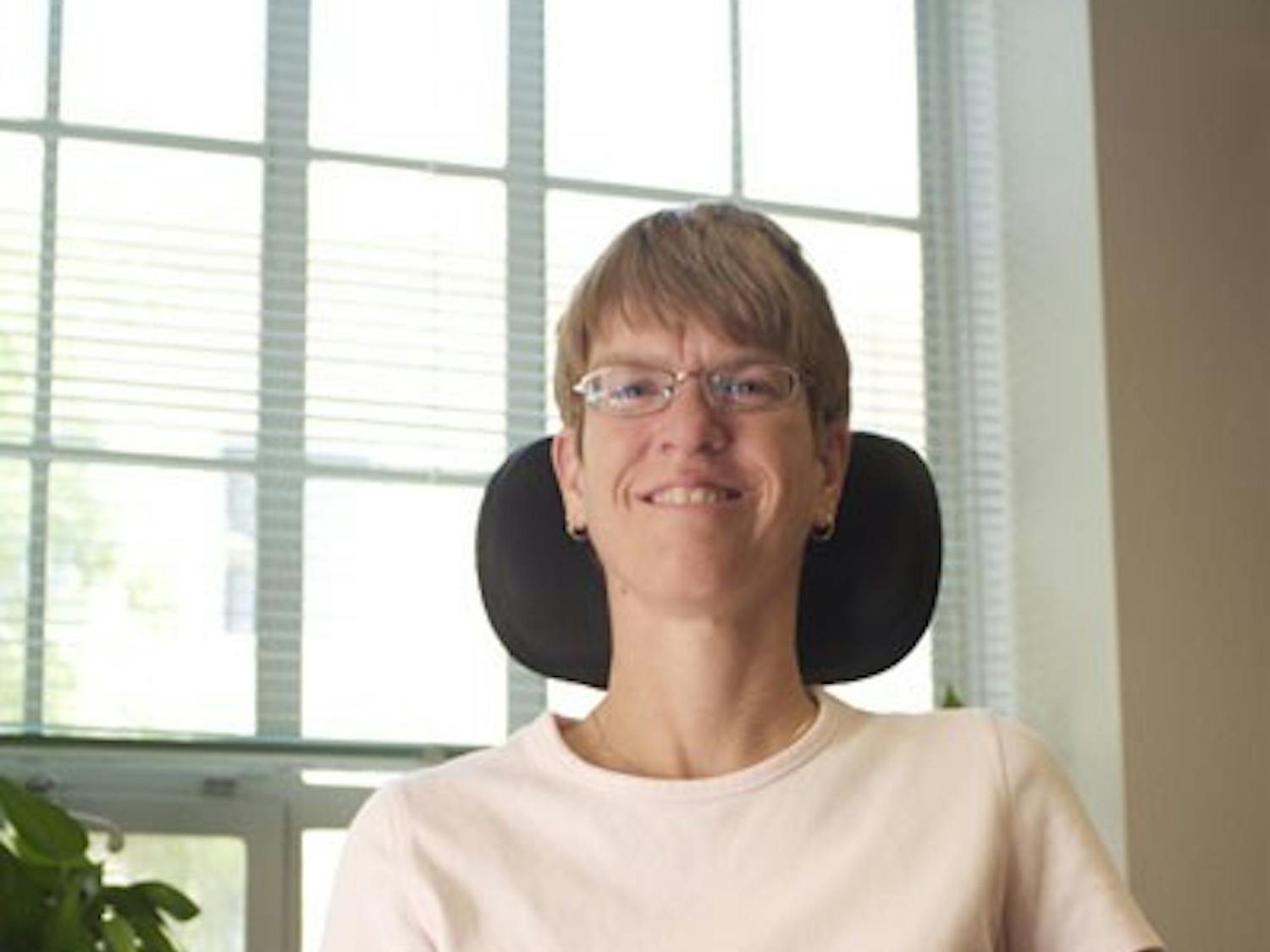 A HELPING HAND: Renae Hackman is the supervisor of testing accommodations at the ASU Disability Resource Center. Living with cerebral palsy, Hackman is an inspiration to the hundreds of students she helps each year. (Photo by Scott Stuk)