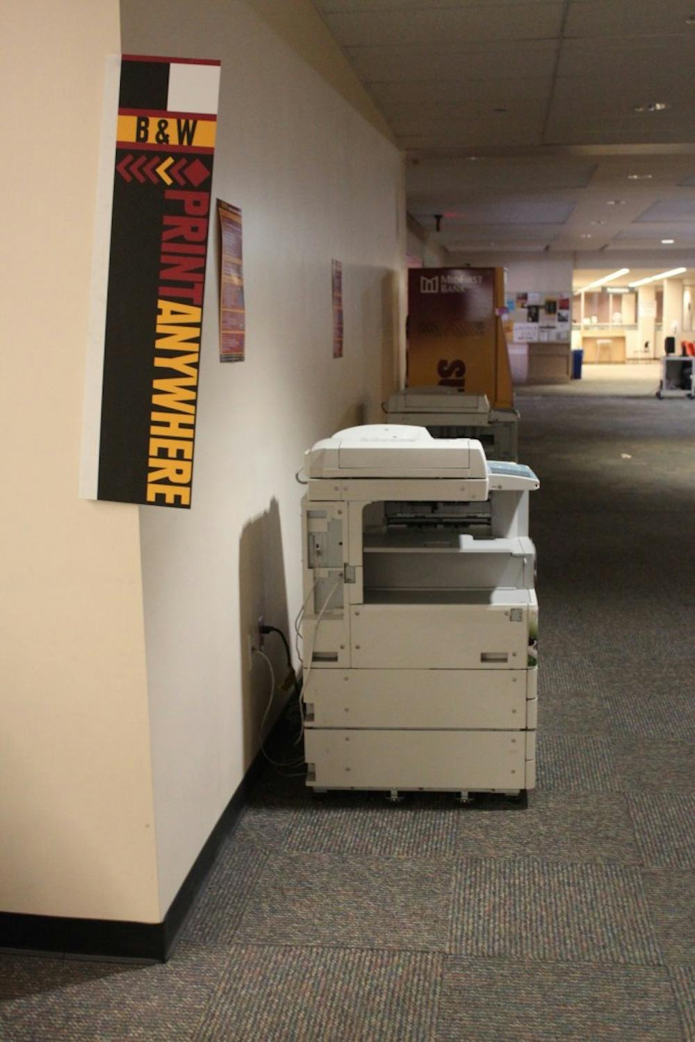 “Print Anywhere” signs are displayed at the Hayden Library in Tempe. Students are now allowed to print before putting money on their student accounts. (Kat Simonovic/The State Press)