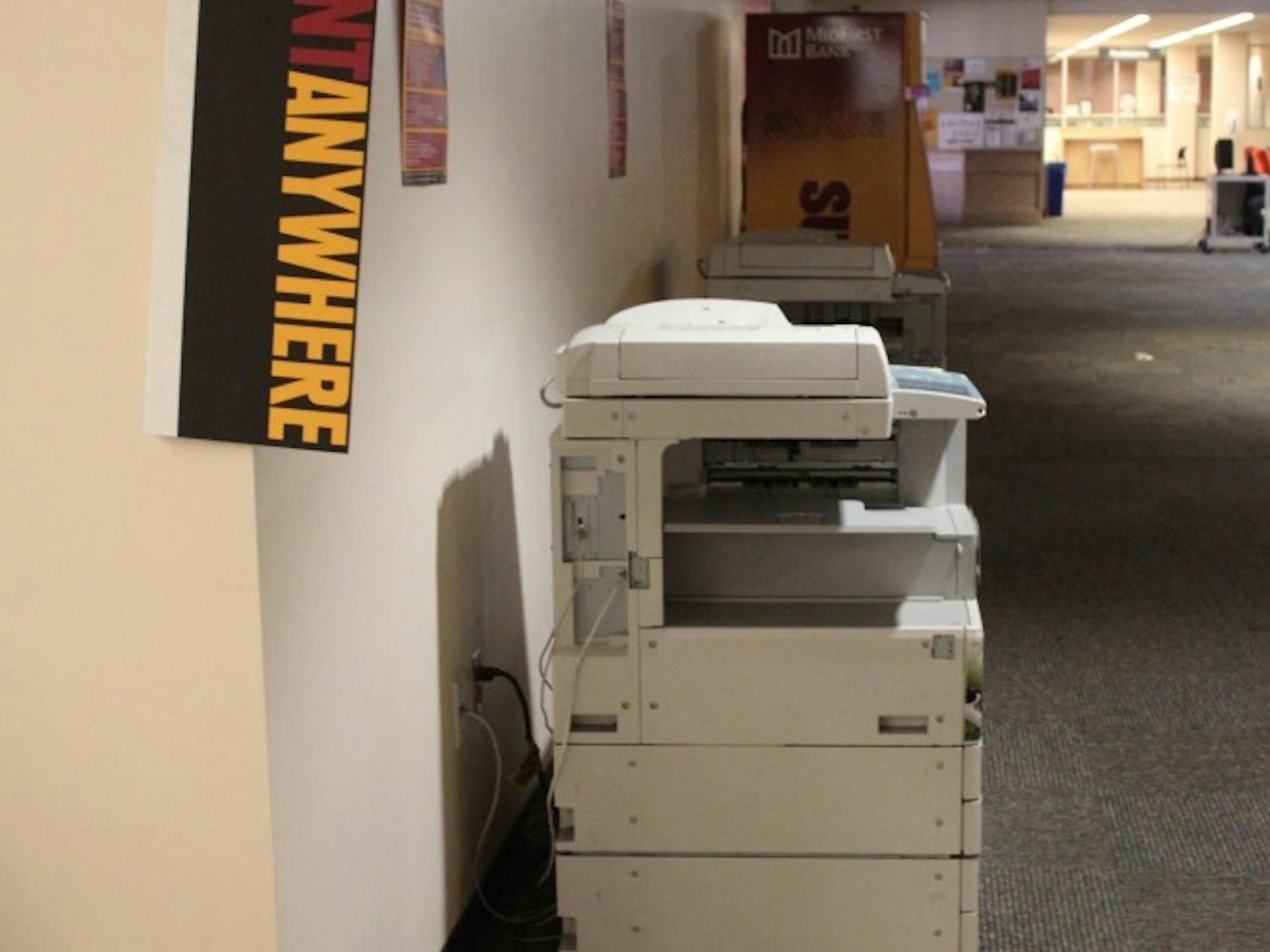 “Print Anywhere” signs are displayed at the Hayden Library in Tempe. Students are now allowed to print before putting money on their student accounts. (Kat Simonovic/The State Press)
