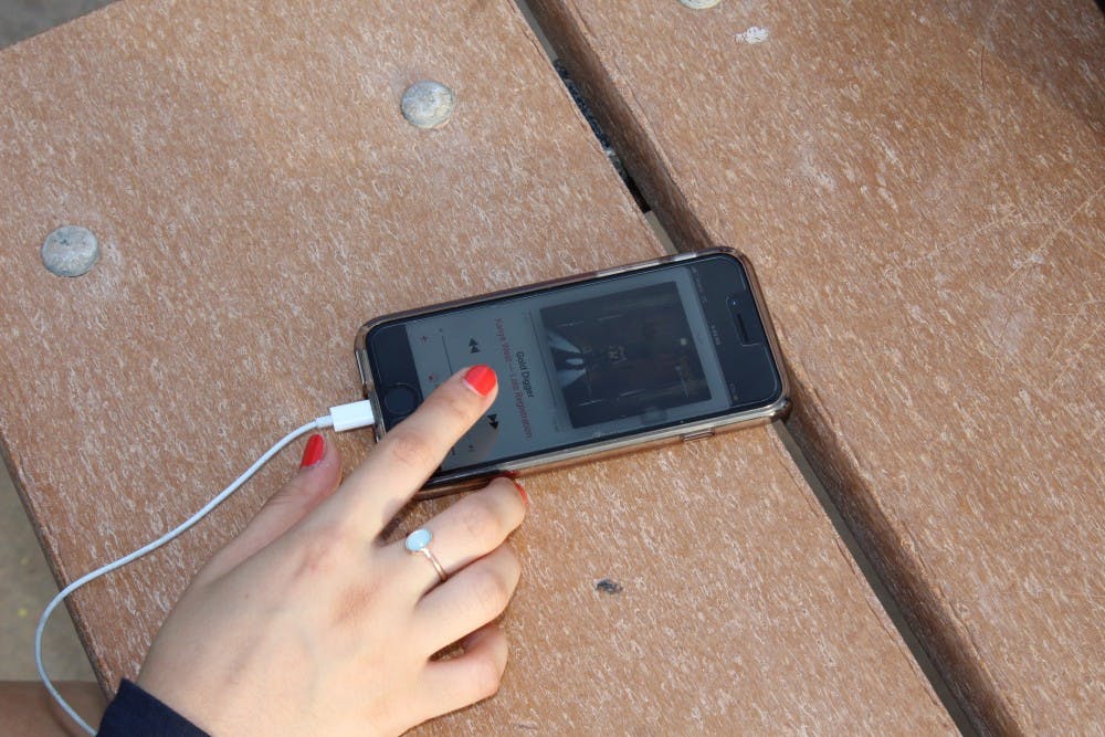 Bana Muhammedali, senior at Millennium High School, listening to music on Oct. 17, 2017 at Aleppo Park in Goodyear, AZ.