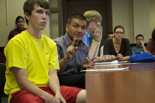 DOWNTOWN DISQUALIFICATION: Andres Cano, right, and Vaughn Hillard, former candidates for the asASUd President &Vice Presidential ticket, present the case for the reversal of their disqualification to the Downtown Elections Committee. Cano and Hillard were disqualified just minutes after polls closed Wednesday night, despite winning 60% of the votes they had just incurred 10 infraction points and were disqualified. (Photo by Molly Smith)