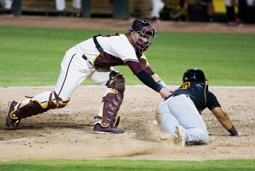 Junior catcher Brian Serven throws out USC junior catcher Jeremy Martinez on Friday, May 27, 2016, at Phoenix Municipal Stadium in Phoenix. The Sun Devils defeated the Trojans 3-2.