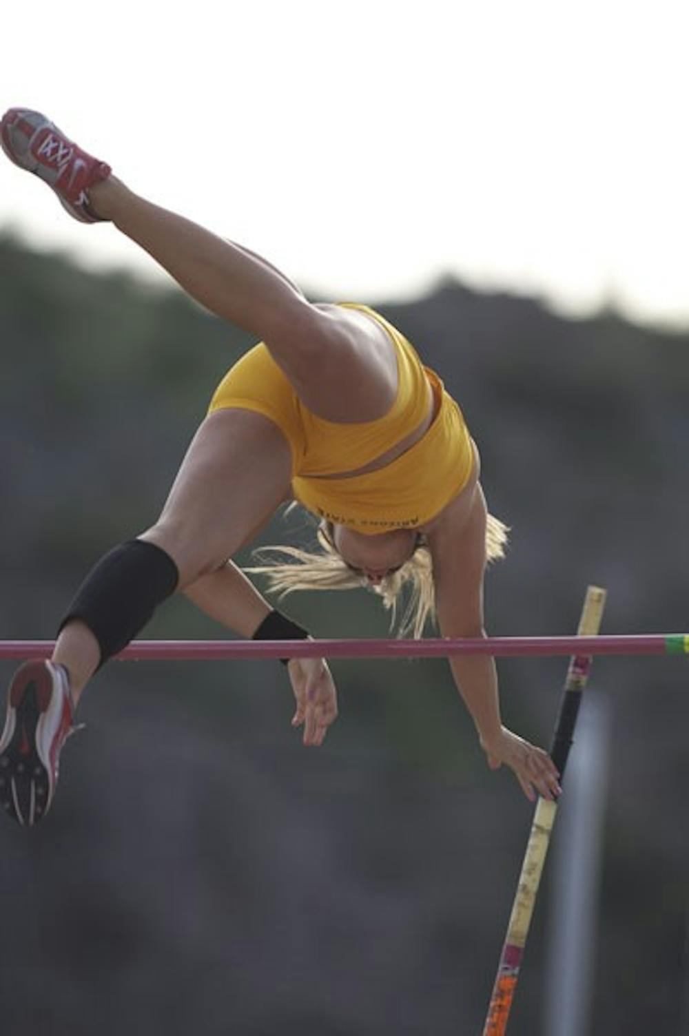 OVER THE WALL: Sophomore pole vaulter Cara Carpenter makes it over the pole during the Baldy Castillo Invitational in March. Carpenter was one of many Sun Devils that starred at the Sun Devil Open, winning the pole vault by reaching 3.77 meters (12-04.50 feet). (Photo by Scott Stuk)