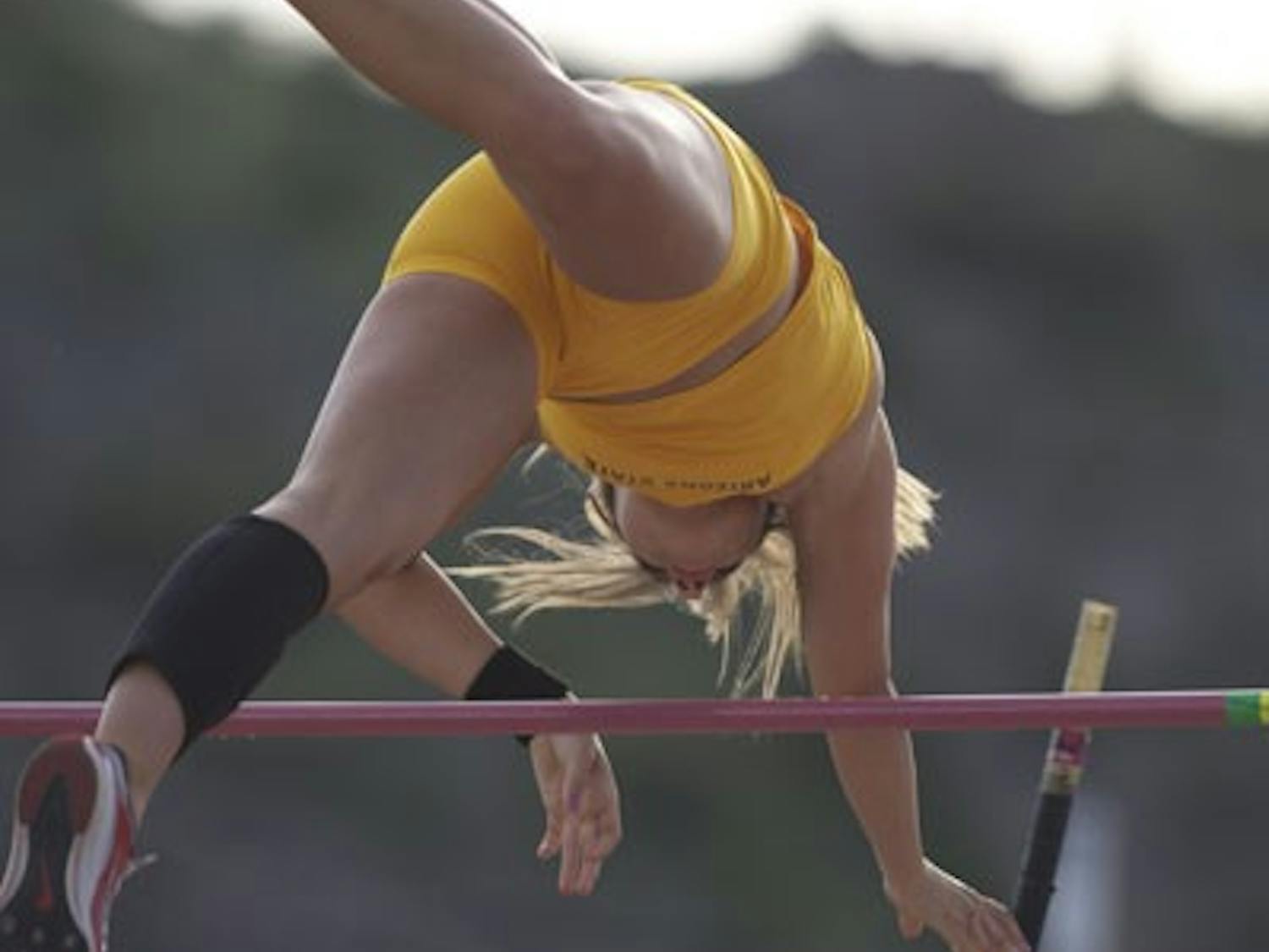 OVER THE WALL: Sophomore pole vaulter Cara Carpenter makes it over the pole during the Baldy Castillo Invitational in March. Carpenter was one of many Sun Devils that starred at the Sun Devil Open, winning the pole vault by reaching 3.77 meters (12-04.50 feet). (Photo by Scott Stuk)