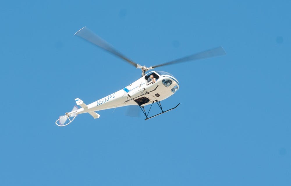 A helicopter circles above the Tempe campus on Monday, Nov. 2, 2015. ASU Police are investigating a shooting threat made against the University last night on the anonymous internet message board 4chan.