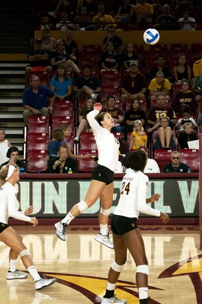 Junior outside hitter Macey Gardner attacks the ball in a home game against Pepperdine on Sept 20, 2014. (Photo by Mario Mendez)
