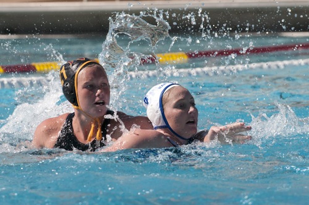 Senior attacker Amanda Young positions herself to get open against Hartwick on March 25. Young switched from goalie to attacker and it paid dividends for Young and ASU water polo. (Photo by Molly J. Smith)