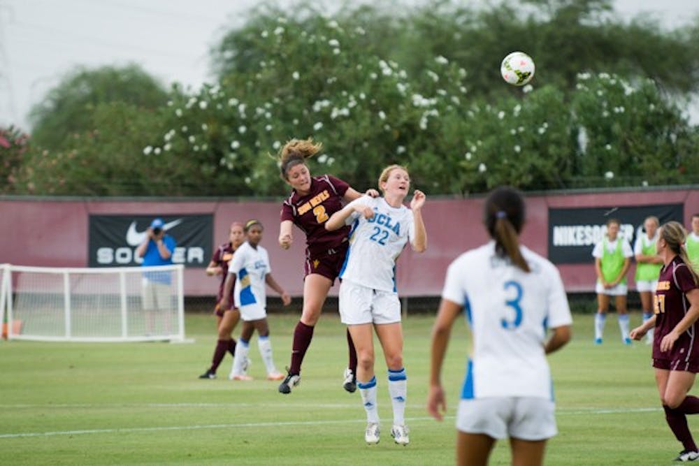 Junior midfielder Whitney Kanavel hits the ball during the game against UCLA on Sept. 26 in Tempe. (Photo by Andrew Ybanez)
