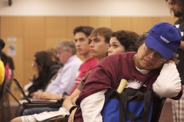 LONG MEETING: A woman fell asleep during the tuition hearing that was held early Monday evening in the Memorial Union. At the hearing, students discussed the new tuition increase. (Photo by Scott Stuk)