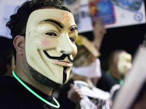 A protestor participates in the Million Mask March held by Arizona Anonymous in Downtown Phoenix on Friday, Nov. 4, 2016.