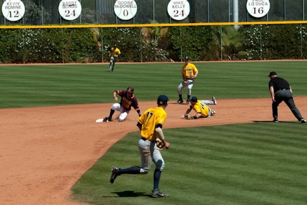 Freshman infielder/outfielder Dalton DiNatale slides safely into second, defying a certain tag out. ASU lost 5-3 against California on April 13, 2014. (Photo by Mario Mendez)