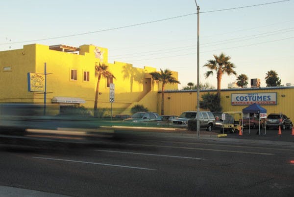 Cars rush past Easley's Fun Shop on 7th Avenue and McDowell Road in downtown Phoenix. Oct. 29th was the last day to get a costume at Easely's before Halloween. (Photo by W. Scot Grey)