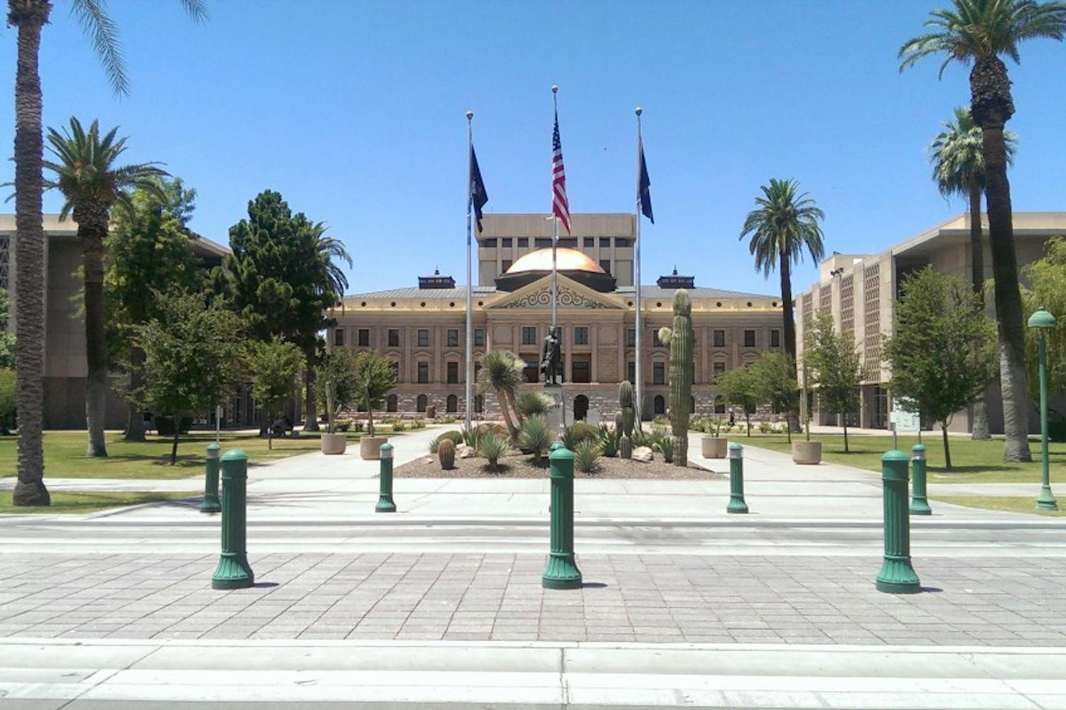 Representatives who support and oppose Prop. 123 worked within the Arizona Capitol building on May 18, 2016. 