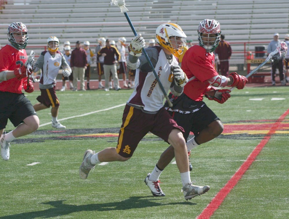 Contested run: ASU sophomore defender Bryan Siegel sprints downfield during the Sun Devils’ 11-8 victory over UNLV on Sunday. The team lost to Michigan in the National Championship game last year, and are already No. 2 in the polls this season. (Photo by Lisa Bartoli)