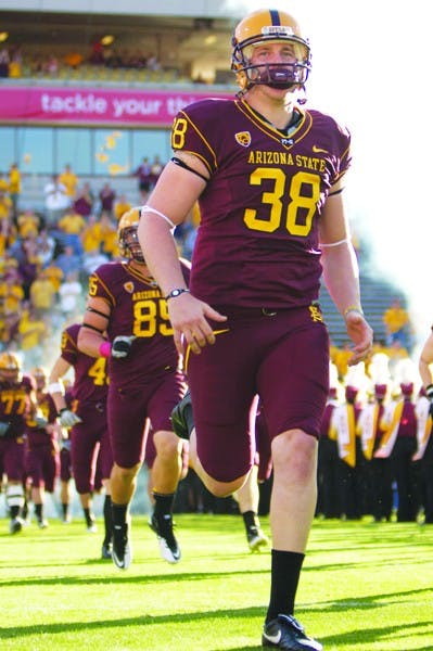 BIG BOOT: Redshirt senior punter Trevor Hankins takes the field earlier this season. Hankins 45.5 yards per punt average is currently third in the Pac-10 Conference and 10th  in the nation. (Photo by Scott Stuk)