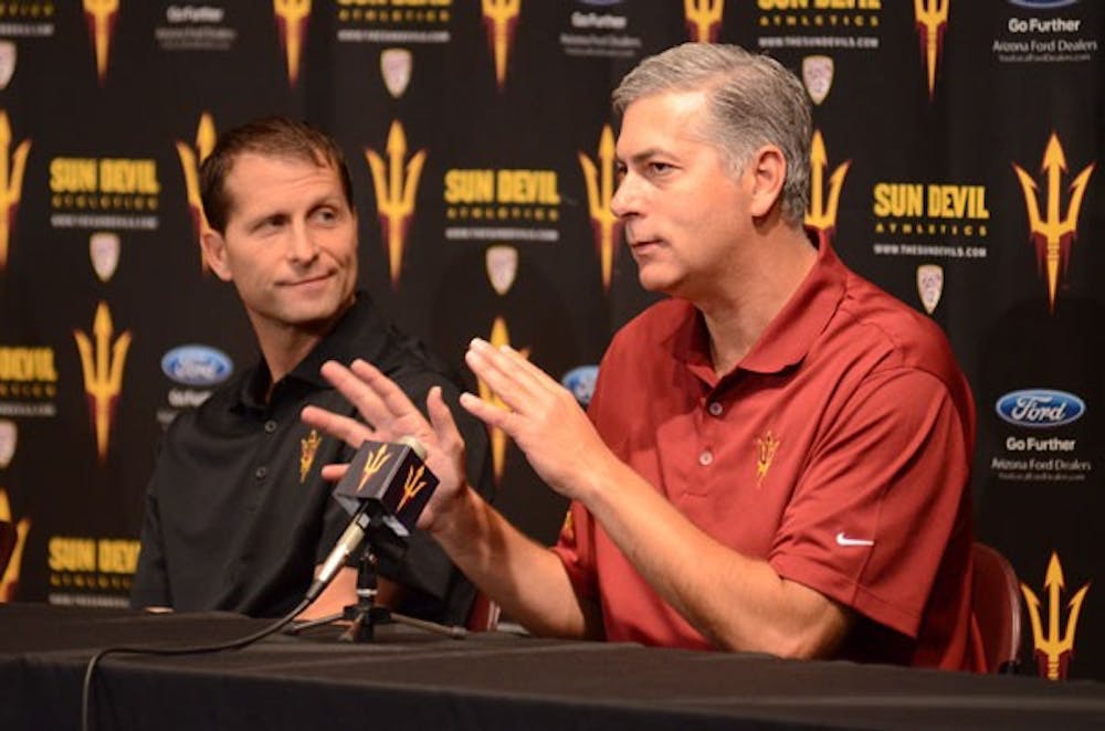 Newly hired assistant coach Larry Greer (right) addresses the media, as fellow new assistant Eric Musselman (left) looks on during their introductory press conference on Tuesday. (Photo by Aaron Lavinsky)

