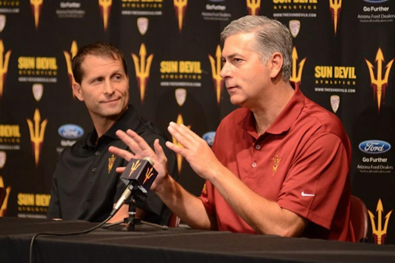 Newly hired assistant coach Larry Greer (right) addresses the media, as fellow new assistant Eric Musselman (left) looks on during their introductory press conference on Tuesday. (Photo by Aaron Lavinsky)

