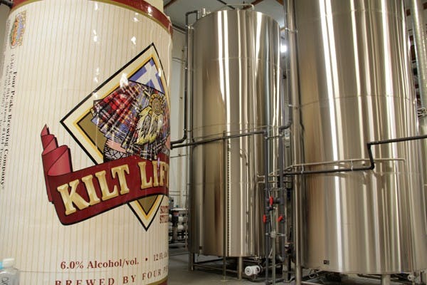 At its newest Tempe location near Broadway Road and Roosevelt Street, Four Peaks Brewery’s reverse osmosis system for water is housed in the giant version of their Kilter Lifter can. (Photo by Shawn Raymundo)