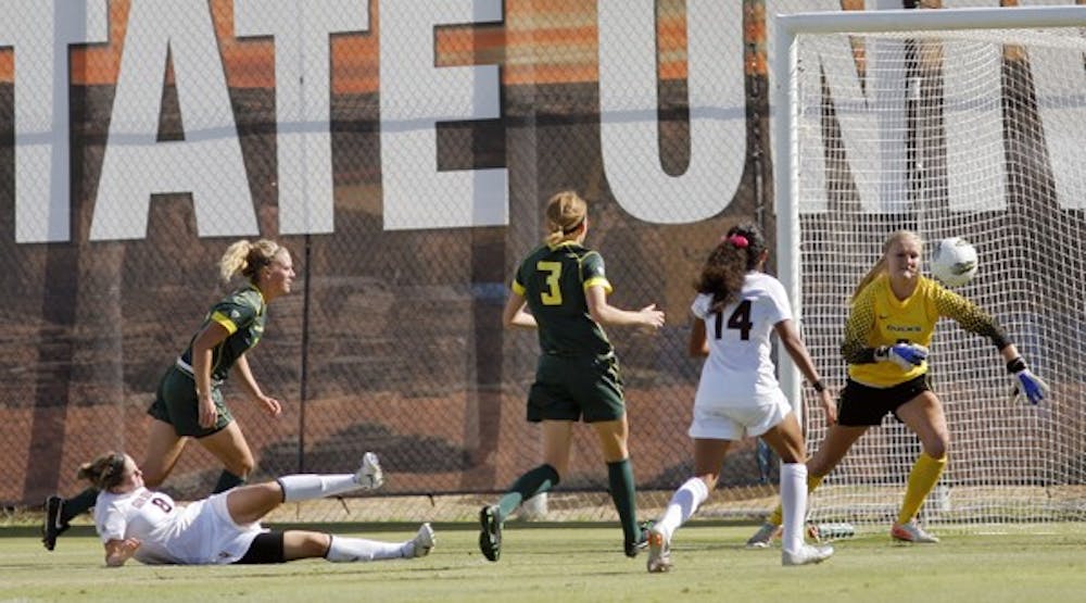 BREAKTHROUGH: ASU sophomore forward Devin Marshall slots in her first goal of the game in the 12th minute against Oregon. Marshall would put in a second goal in the 68th, and the Sun Devils went on to win 4-0. (Photo by Monica Arevalo)