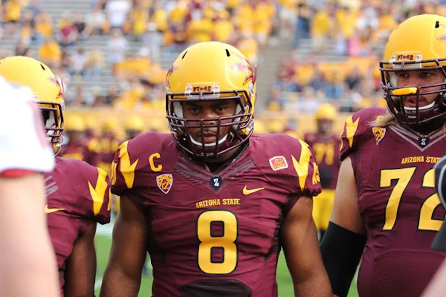 Redshirt senior linebacker Brandon Magee stands with his fellow captains during the coin toss in ASU’s 46-7 win over Washington State on Nov. 17. (Photo by Kyle Newman)