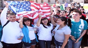 High school and college students gathered at the state Capitol Friday to protest a bill that would require illegal immigrants to show proof of citizenship before enrolling a child in an Arizona school. The demonstration was organized through text messaging and social media sites. (Photo by Beth Easterbrook)