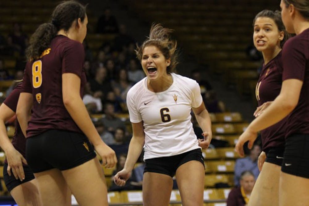 Junior libero Stephanie Preach celebrates with her team after a point during the Sun Devils’ 3-2 loss at Colorado on Oct. 12. (Photo by Kyle Newman)