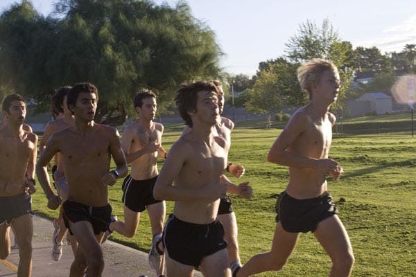 STICKING TOGETHER: The ASU men's cross country team runs together at practice last week. The men finished fourth in Saturday's George Kyte Invitational. (Photo by Annie Wechter)
