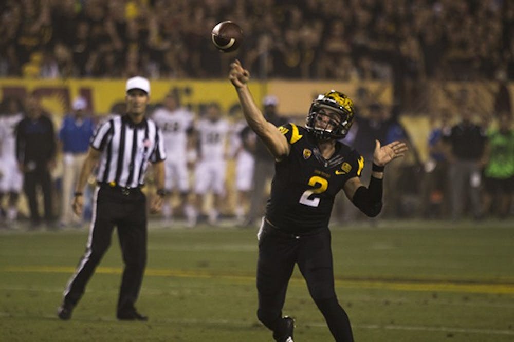 Redshirt junior quarterback Mike Bercovici throws the ball in a home game against UCLA on Sept. 25, 2014. The Sun Devils lost to the Bruins, 62-27. (Photo by Alexis Macklin)