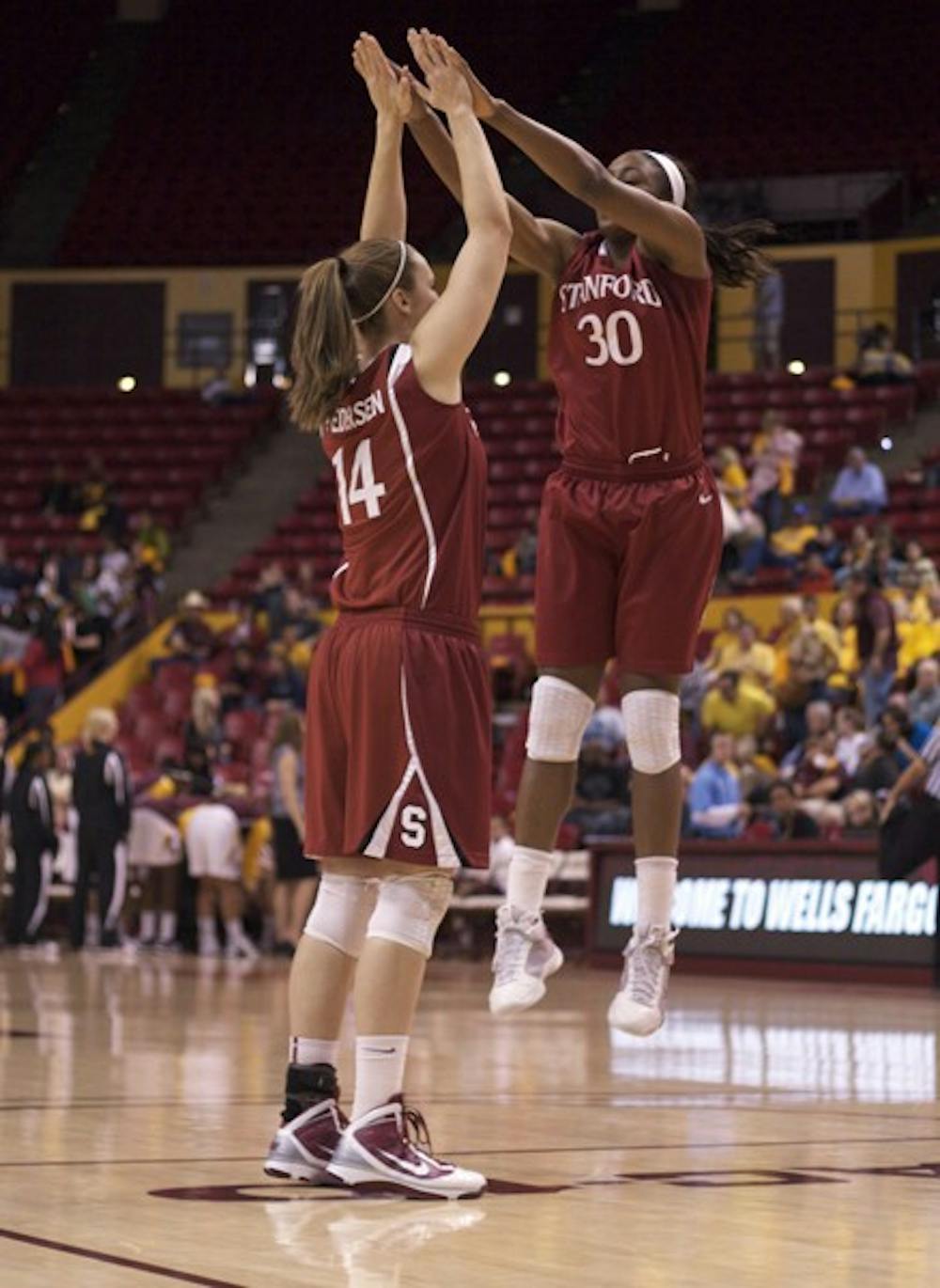 Stanford University’s Kayla Pedersen (left) high fives Nnemkadi Ogwumike (right) during a game against ASU on Feb. 25, 2010. The No.4 Cardinal is favored to win the Pac-12 this season. (Photo by Scott Stuk)