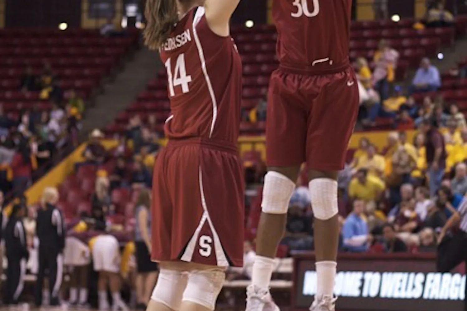 Stanford University’s Kayla Pedersen (left) high fives Nnemkadi Ogwumike (right) during a game against ASU on Feb. 25, 2010. The No.4 Cardinal is favored to win the Pac-12 this season. (Photo by Scott Stuk)