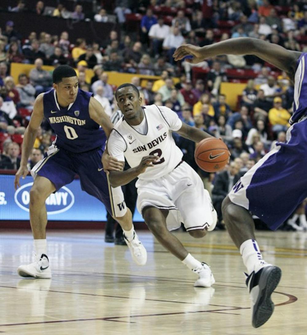 Washington’s Abdul Gaddy (0) defends the lane against Chris Colvin in a game Jan. 26. Washington is one of the few Pac-12 teams likely to be selected for the NCAA tournament. (Photo by Sam Rosenbaum)