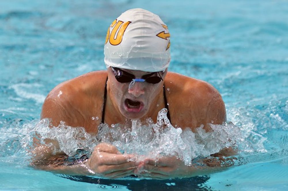 Rebecca Ejdervik swims the breaststroke in a meet against Wisconsin on Nov. 5, 2011. Ejdervik is one of nine seniors that will be recognized against UA on Saturday. (Photo by Aaron Lavinsky)