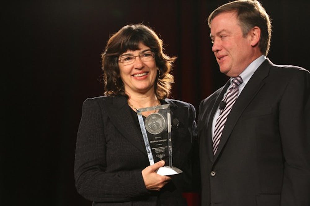 AMANPOUR AWARD: Longtime broadcast journalist Christiane Amanpour was presented with the Walter Cronkite Award for Excellence in Journalism by ASU President Michael Crow Thursday afternoon at the Cronkite Awards Luncheon in Phoenix. (Photo by Lisa Bartoli)