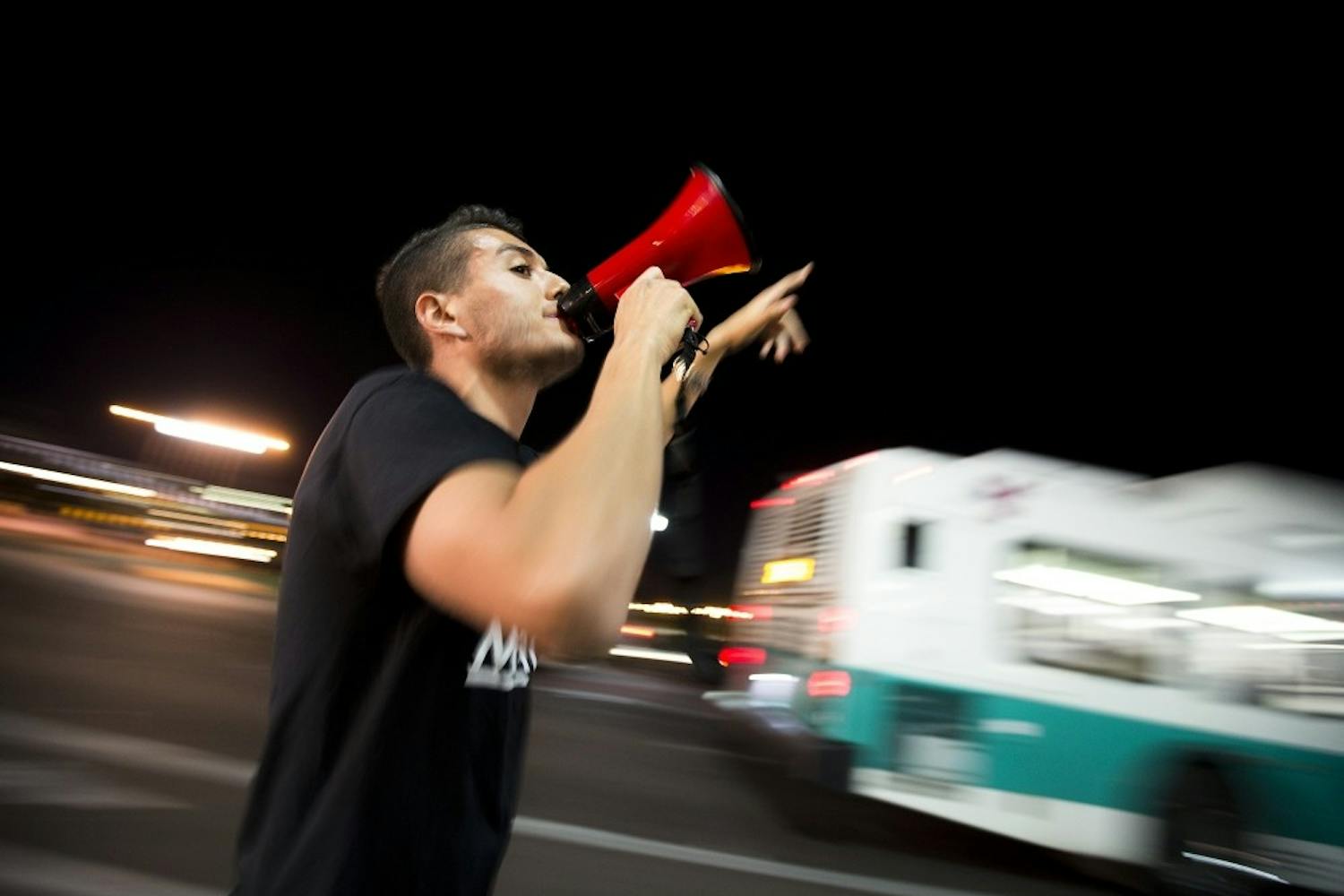 Organizer Randy Perez starts a chant during an election results protest on the ASU Tempe campus on Saturday, Nov. 12, 2016.