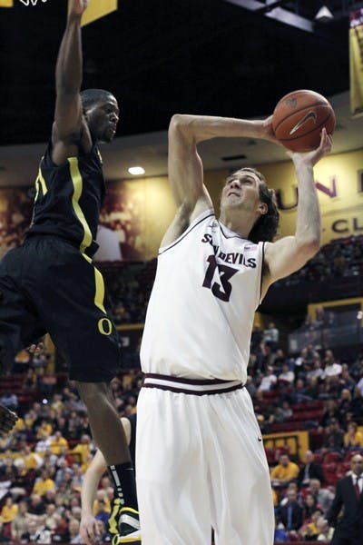 Jordan Bachynski puts up a shot in a game against Oregon on Jan. 12. The Sun Devils will attempt to break Colorado’s home winning streak Thursday night. (Photo by Sam Rosenbaum)