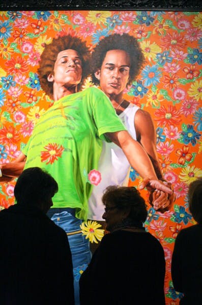 Guests take a look at artist Kehinde Wiley's work after a discussion on Wednesday night at the Phoenix Art Museum. (Photo by Perla Farias)