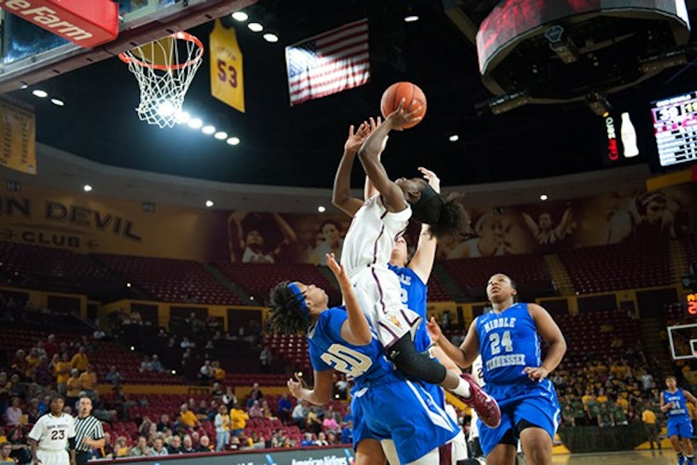 Senior guard Promise Amukamara drives to the basket in a game against Middle Tennessee, Friday. Nov. 14, 2014 at Wells Fargo Arena in Tempe. The Sun Devils defeated the Blue Raiders 81-67. (Photo by Ben Moffat)