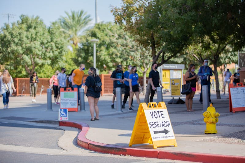 ASU students line up at the SDFC to drop off their ballots and vote in person on the Tempe Campus in Tempe, Arizona, on Tuesday, Nov. 3, 2020.