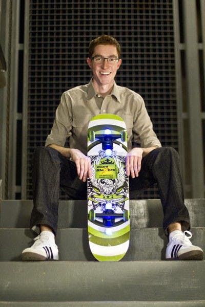 Greg Rudolph, a Barrett Honors college junior shows off his LED lights that can be placed on the bottom of skateboards. The lights are available for purchase at Boardblazers.com. (Photo by Vince Dwyer)