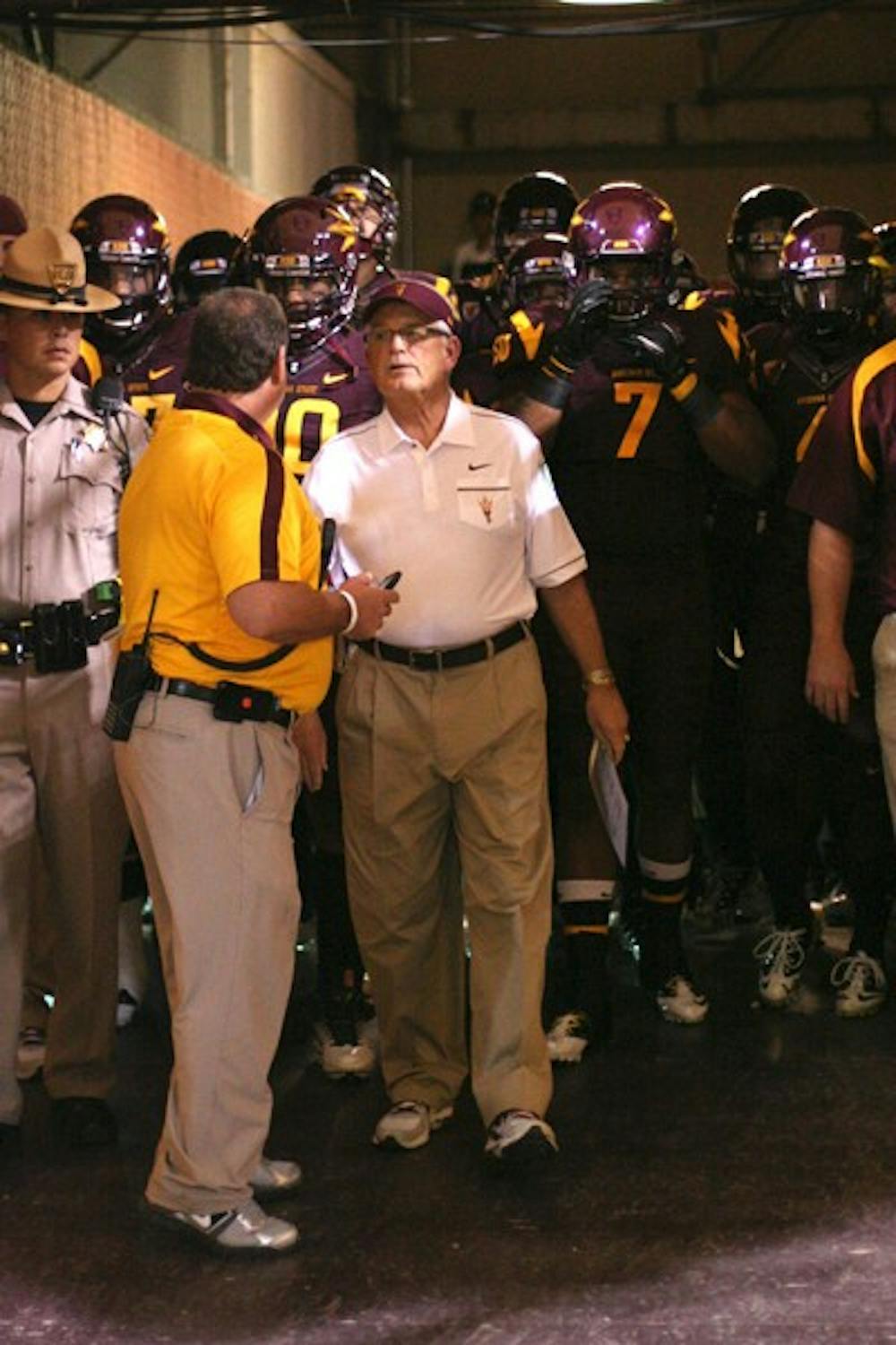 STILL THE LEADER: ASU coach Dennis Erickson leads the Sun Devil football team heading onto the field through the Pat Tillman Tunnel against USC on Sept. 24.  Erickson said he remains focused for ASU’s rivalry game against UA on Saturday, despite hearing rumors regarding his job security. (Photo by Lisa Bartoli)