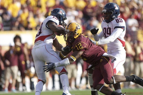 HARD HIT: Matthew Tucker goes for a tackle against the UA Wildcats during last season's final game. (Photo by Scott Stuk)
