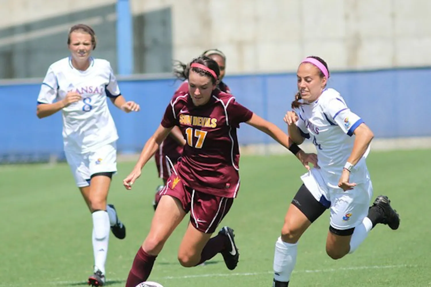 Junior forward Cali Farquharson dribbles past Kansas defenders in the Sun Devils’ 2-2 draw to the Jayhawks on Sunday, Sept. 3, 2012. (PHOTO COURTSEY OF STEVE RODRIGUEZ)
