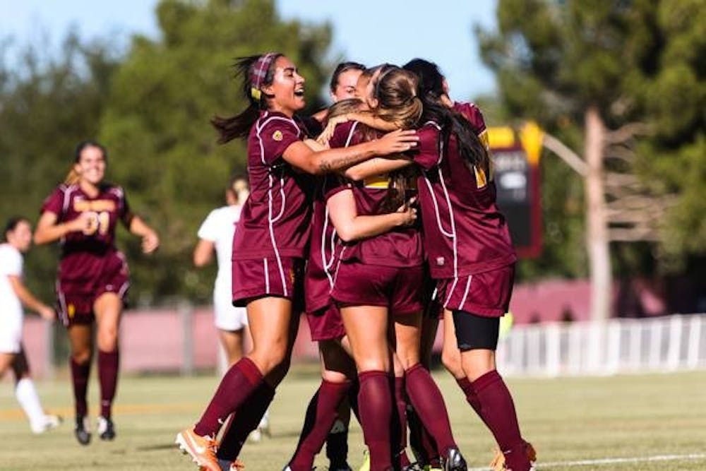 Members of the ASU women's soccer team celebrate a 1-0 win over UA that ultimately clinched the Sun Devils a playoff spot. (Photo by Daniel Kwon)