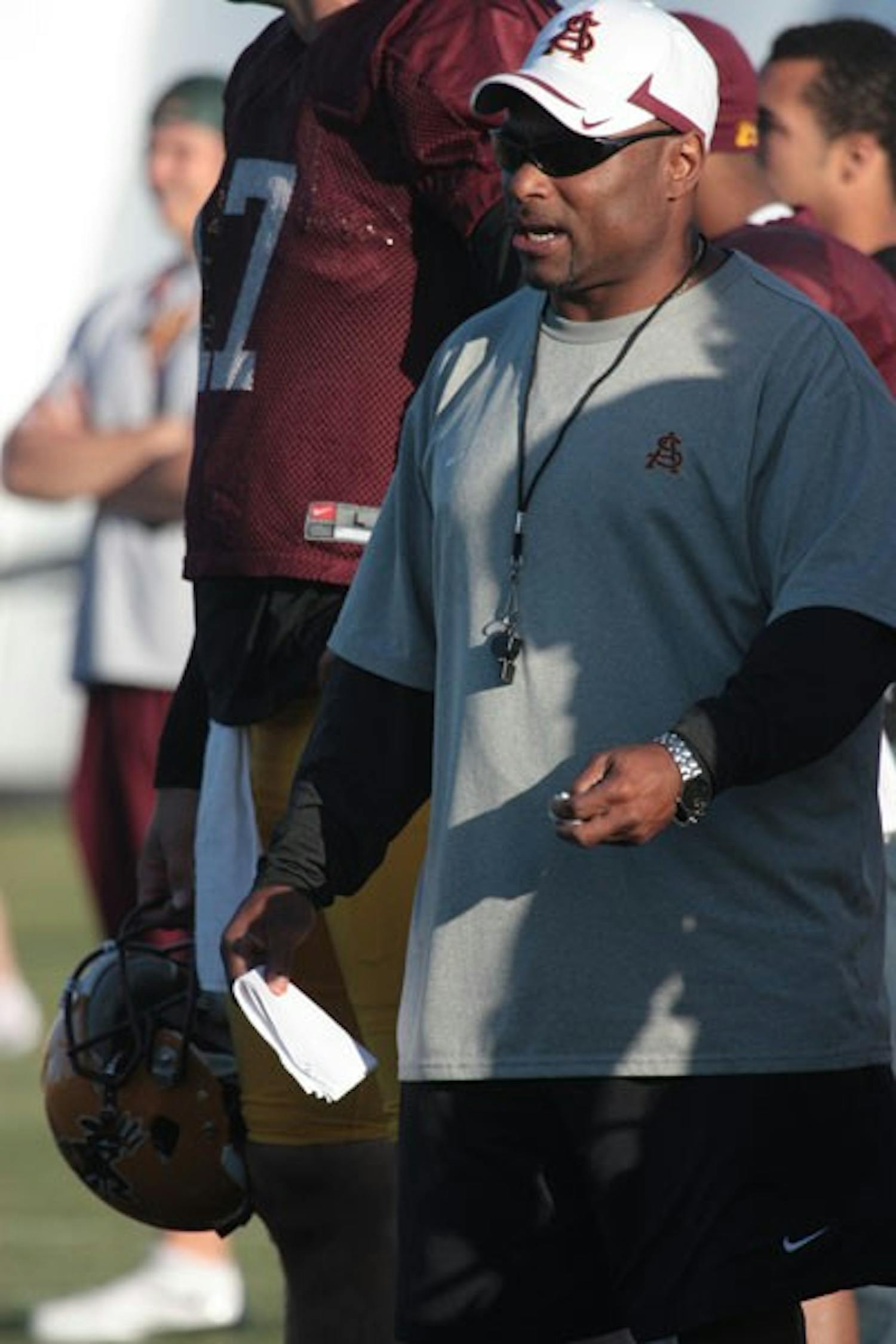 FIRM, FAIR, FLEXIBLE: ASU wide receivers coach Steve Broussard offers instructions during a spring practice earlier this month at Bill Kajikawa practice field. (Photo by Nick Kosmider)